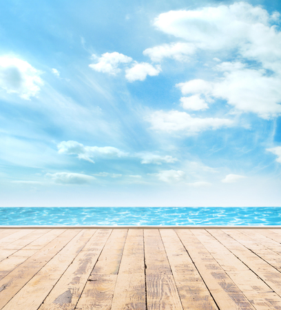 Wooden pier, exotic sea and the blue sky. Beautiful summer background. Vacation and traveling concept.の写真素材