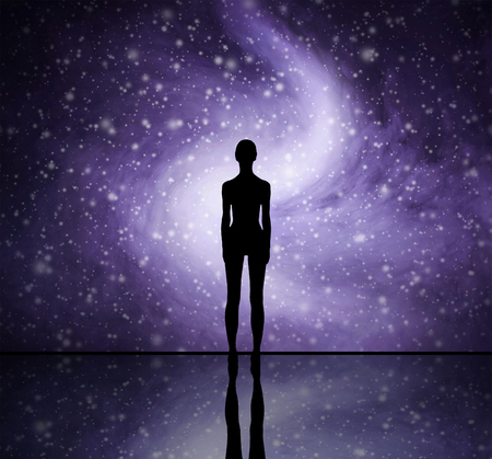 Human shape over the stellar background. Space traveling and evolution concept.の写真素材