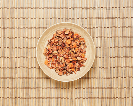 Plate with aroma petals on bamboo mat. Spa, beauty, treatment concept.の写真素材