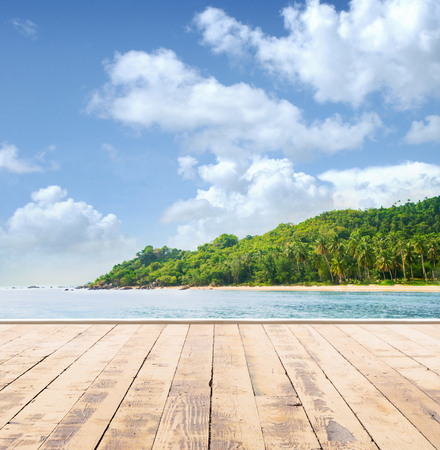 Wooden pier, exotic sea and a blue sky. Beautiful summer background. Vacation and traveling concept.の写真素材