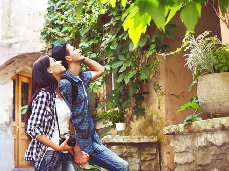 Couple of young travellers: walking around old town. Vacation, summer, holiday, tourism: concept.の写真素材