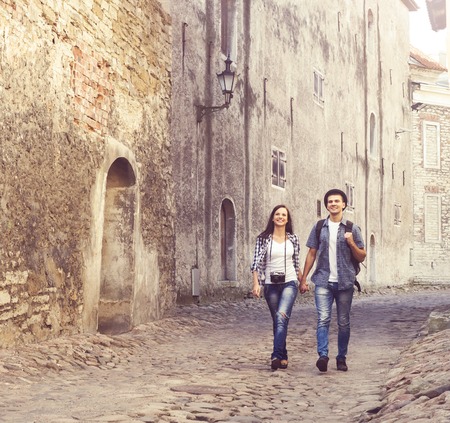 Travelling couple of hipsters: walking around old town. Vacation, summer, holiday, tourism: concept.の写真素材
