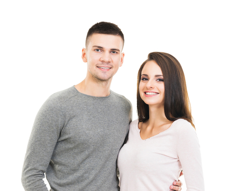 Young isolated couple. Man and woman over white background.の写真素材