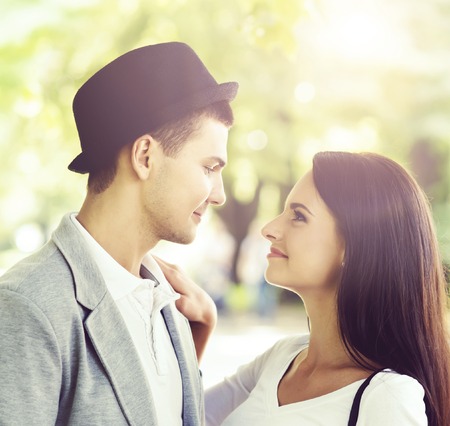 Young beautiful couple of hipsters: hugging in the park. Love, relationship, dating: concept.の写真素材