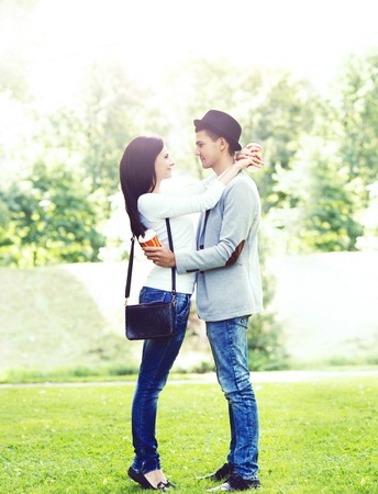Young beautiful couple of hipsters: hugging in the park. Love, relationship, dating: concept.の写真素材