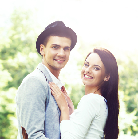 Young beautiful couple of hipsters: hugging in the park. Love, relationship, dating: concept.の写真素材