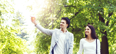 Young beautiful couple walking in the park. Love, relationship, dating: concept.の写真素材