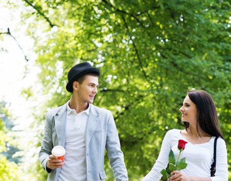Young beautiful couple having a date in the park.の写真素材