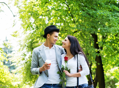 Young beautiful couple having a date in the park.の写真素材