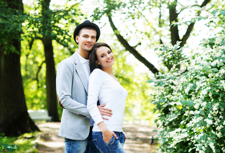 Young beautiful couple posing in the park.の写真素材