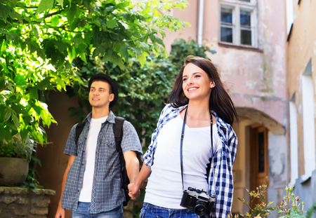 Young couple being tourists exploring an old town.の写真素材