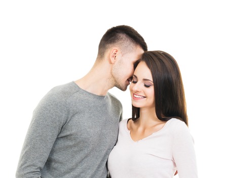 Young isolated couple. Man and woman over white background.の写真素材