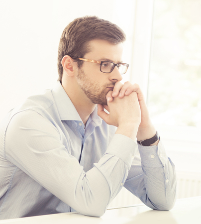 Close-up portrait of confident businessman working in a modern office. Business concept.の写真素材