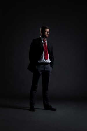 Businessman over black background. Business and office concept.の写真素材