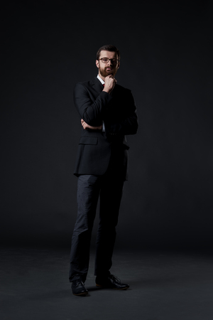 Businessman over black background. Business and office concept.の写真素材