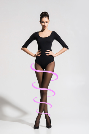 Young and beautiful woman in hosiery. Girl with perfect shape. Weight loss, fitness, sport and diet concept.の写真素材