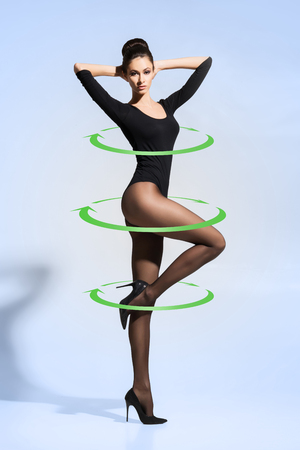 Young and beautiful woman in hosiery. Girl with perfect shape. Weight loss, healthy eating, nutrition fitness, sport and diet concept.の写真素材