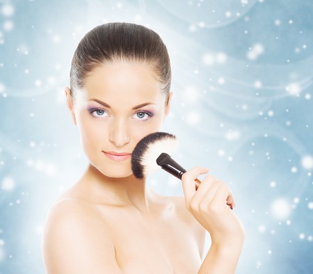 Spa portrait of young and beautiful woman over Christmas background. Face lifting and plastic surgery winter concept.の写真素材