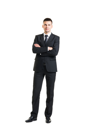 Young and confident business man. Businessman in suit isolated on white.の写真素材
