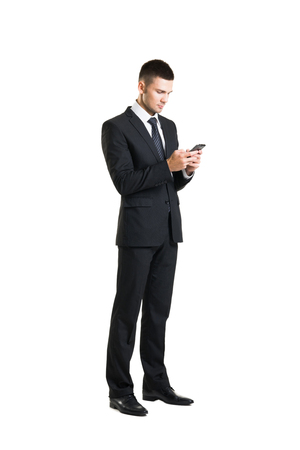 Young and confident business man. Businessman in suit isolated on white.の写真素材