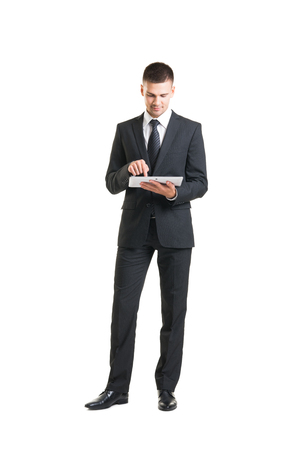 Young and confident business man. Businessman in suit isolated on white.の写真素材