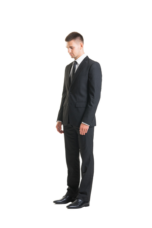 Young and confident business man. Businessman in suit isolated on white.の写真素材