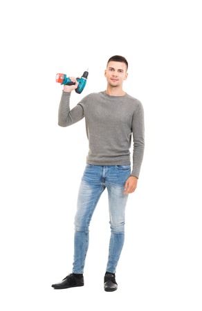 Man moving in a new home. Guy with tools isolated on white.の写真素材