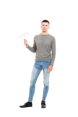 Man moving in a new home. Guy with tools isolated on white.の写真素材