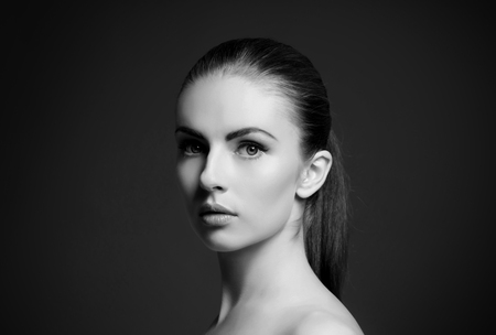 Black and white close-up portrait of beautiful, fresh and healthy girl. Human face isolated on white.の写真素材
