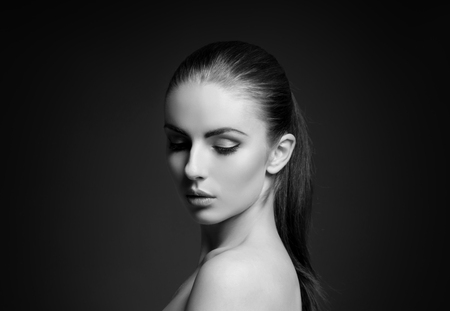 Black and white close-up portrait of beautiful, fresh and healthy girl. Human face isolated on white.の写真素材