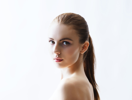 Beauty close-up portrait of beautiful, fresh and healthy girl. Human face isolated on white.の写真素材