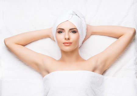Beautiful, young and healthy woman in spa salon. Spa, health and healing concept.の写真素材