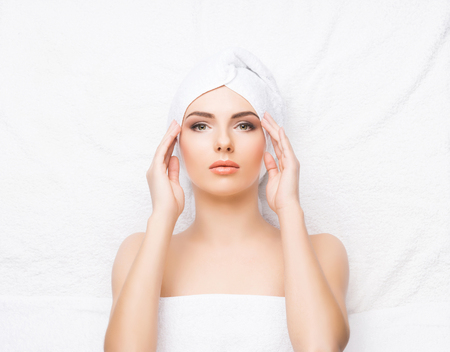 Beautiful, young and healthy woman in spa salon. Spa, health and healing concept.の写真素材