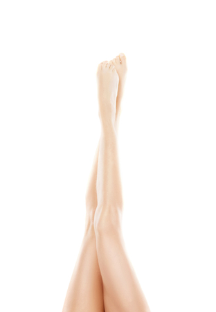 Beautiful, fit and sporty legs isolated on white. Health, sport, fitness, epilation, cellulite and hair removal, liposuction, healthy life-style concept.の写真素材