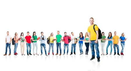 Large group of teenagers isolated on white background. Many different people standing together. School, education, college, university concept.の写真素材