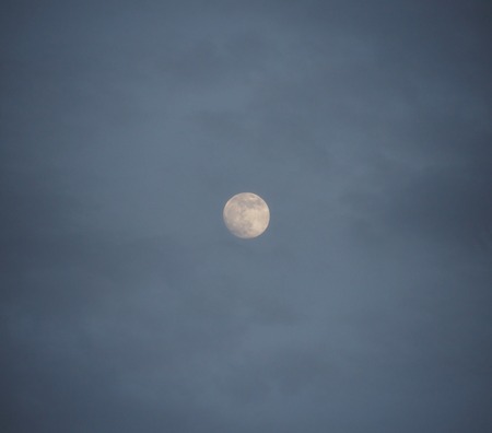 Full moon in the sky at night.の写真素材