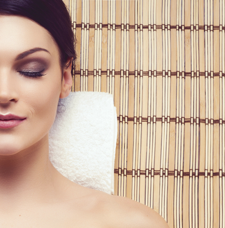 Healthy and beautiful woman getting massage treatment in spa salon.の写真素材