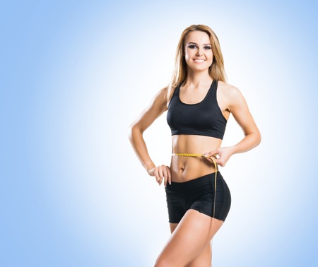 Fit body of beautiful, healthy and sporty woman. Slim woman posing in sportswear.の写真素材