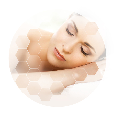 Young and beautiful woman in spa. Collage with honeycomb mosaic tiles. Massaging and healing concept.の写真素材