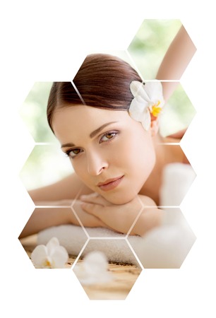 Young and beautiful woman in spa. Collage with honeycomb mosaic tiles. Massaging and healing concept.の写真素材