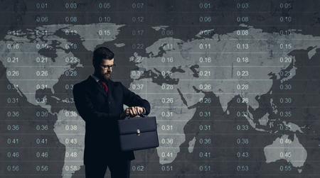 Businessman standing over diagram. World map background. Business, office, career concept.の写真素材