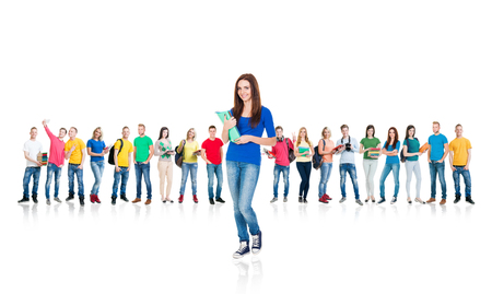 Large group of teenage students isolated on white background. Many different people standing together. School, education, college, university concept.の写真素材