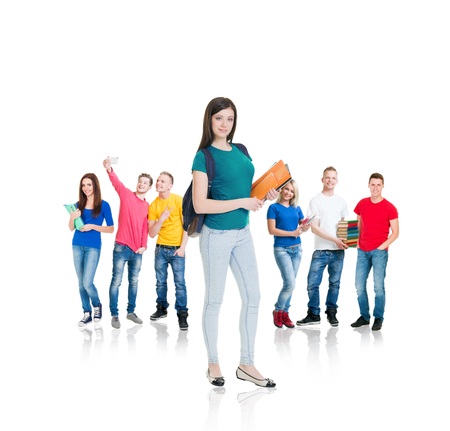 Large group of teenage students isolated on white background. Many different people standing together. School, education, college, university concept.の写真素材