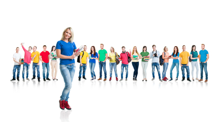 Large group of teenage students isolated on white background. Many different people standing together. School, education, college, university concept.の写真素材