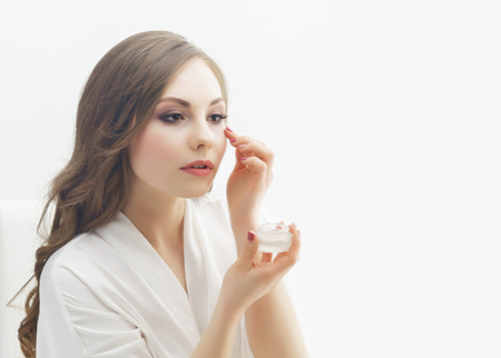 Beauty portrait of young and attractive woman doing make-up.の写真素材