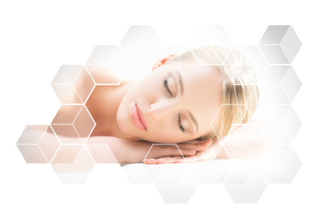 Beautiful and healthy blond woman getting massage treatment in spa salon.の写真素材