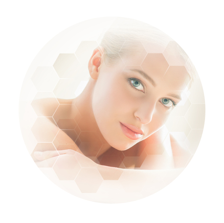 Beautiful and healthy blond woman getting massage treatment in spa salon.の写真素材