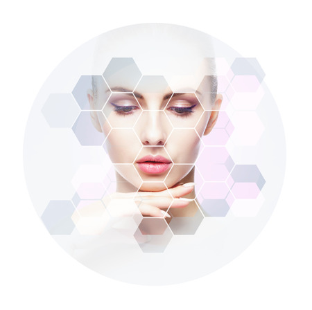 Human face in honeycomb. Young and healthy woman in plastic surgery, medicine, spa and face lifting concept.の写真素材
