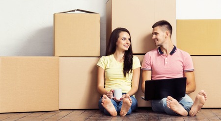 Young loving couple moving to a new house. Home and family concept.の写真素材