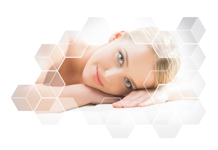 Beautiful and healthy blond woman getting massage treatment in spa salon.の写真素材
